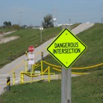 dangerous-intersection-sign-on-bike-trail